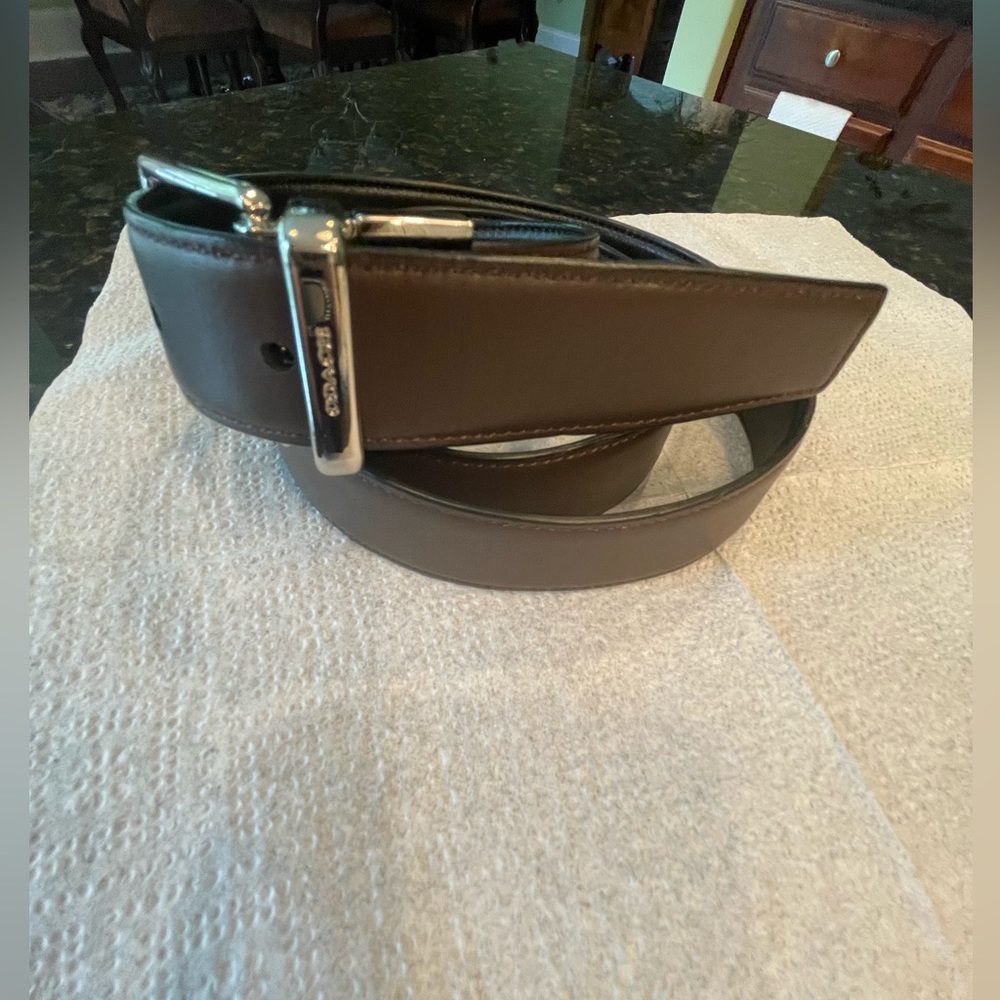 COACH Men’s reversible belt. Black / brown with silver color buckle .